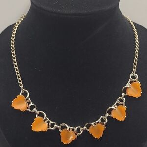 Vintage gold-tone mango thermoset lucite leaf necklace